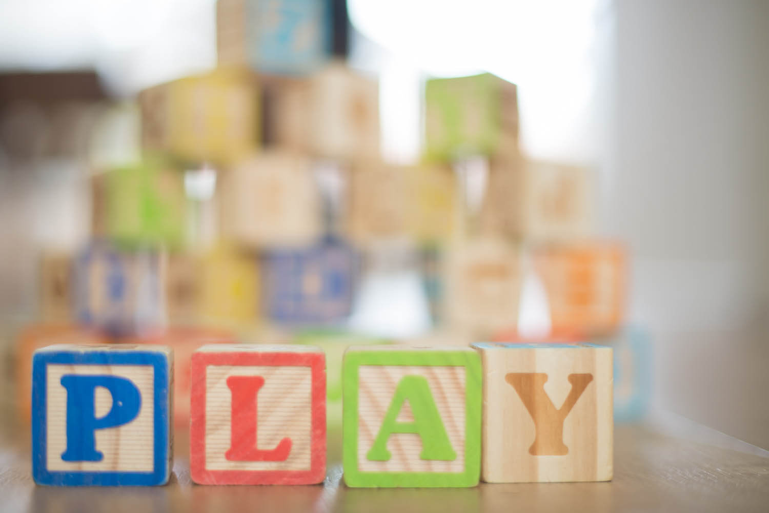 colorful blocks that spell PLAY
