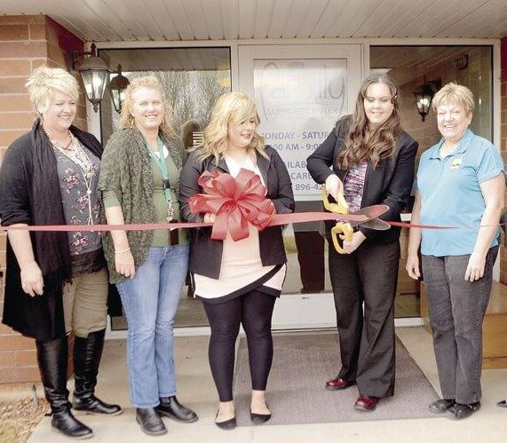 opening the new location, red ribbon cutting